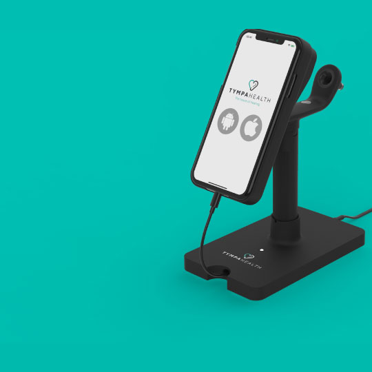 Smartphone displayed on a Tympan Health charging stand, showcasing Android and iOS compatibility. The device is positioned against a teal background.
